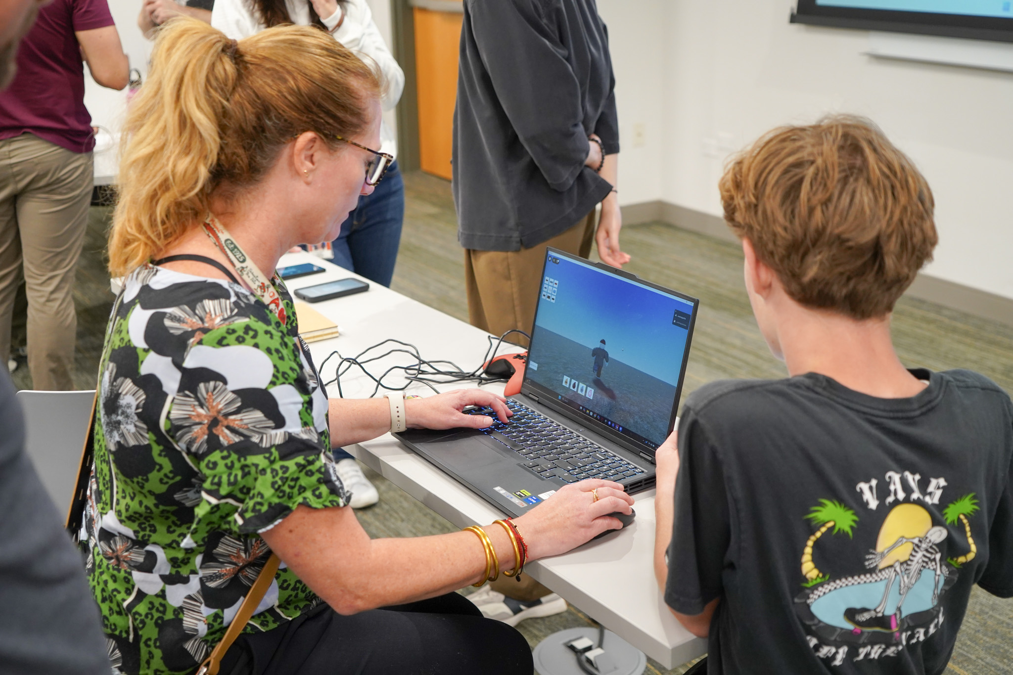 Students discussing a game after playtesting