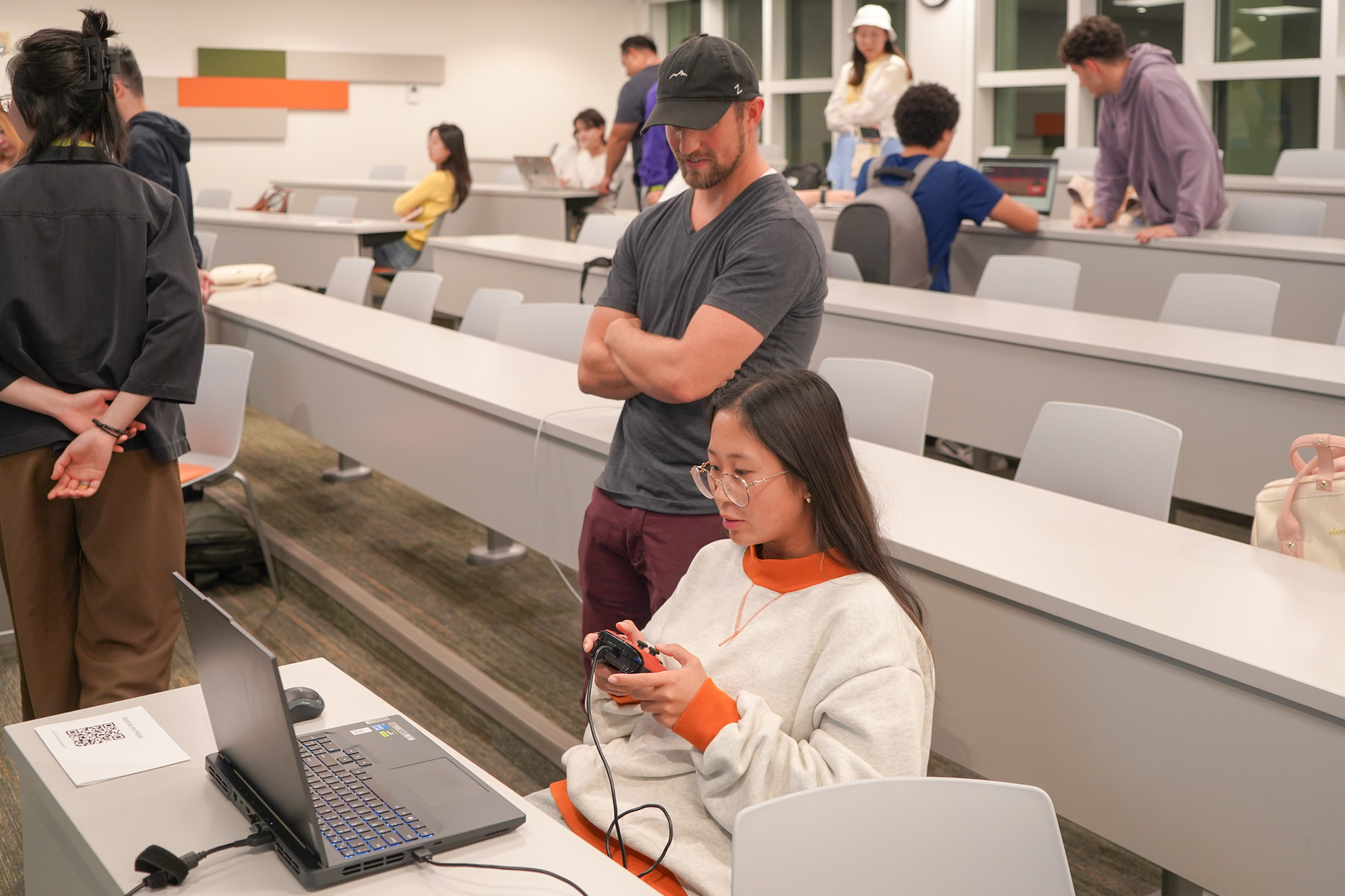 Student demonstrating a game to others